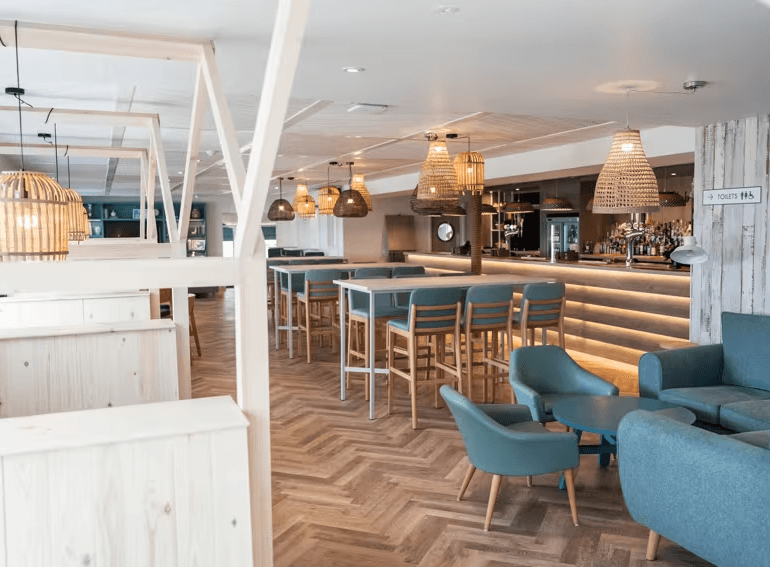 The Yacht Club interior seating area and bar