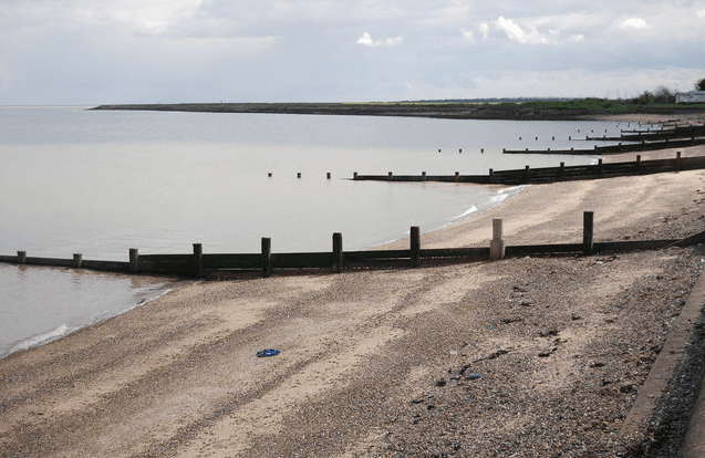 Allhallows beach with the holiday park alongside the Thames Estuary